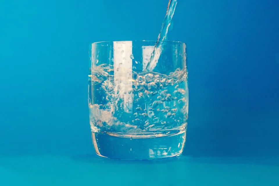 Water being poured into a clear glass